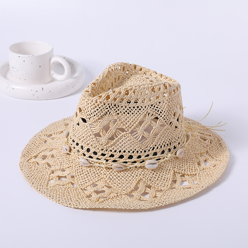 Sombrero de paja primavera y verano nuevo juego de ocio sombrero de playa hueco tejido femenino estilo europeo y americano sombrero de vaquero sombrero de sombrilla al aire libre