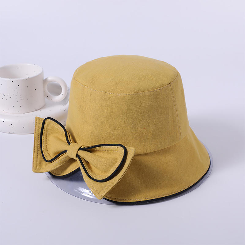 Sombrero de tela con lazo amarillo primavera y verano nuevo juego de ocio sombrero de playa versión coreana femenina del sombrero de pescador sombrilla al aire libre sombrero protector solar