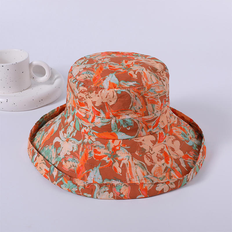 Sombrero de tela de flores primavera y verano nuevo juego de ocio sombrero de playa versión coreana femenina del sombrero de pescador sombrilla al aire libre sombrero protector solar