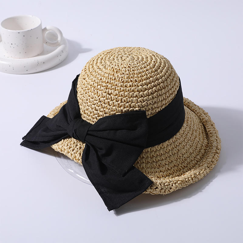 Arco negro sombrero de paja decorativo primavera y verano nuevo juego de ocio sombrero de playa de punto versión coreana femenina del sombrero para el sol sombrero de protección solar al aire libre