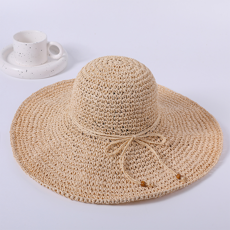 Sombrero de paja liso simple primavera y verano nuevo juego de ocio sombrero de playa de punto versión coreana femenina del sombrero para el sol sombrilla al aire libre sombrero para el sol