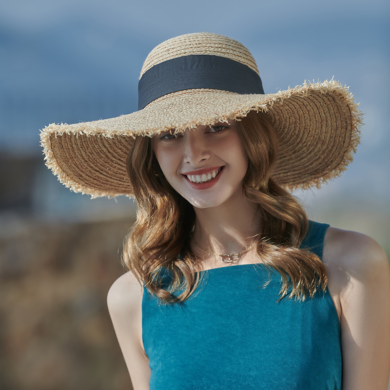 Sombrero de paja con lazo negro primavera y verano nuevo juego de ocio sombrero de playa de punto versión coreana femenina del sombrero para el sol sombrilla al aire libre sombrero para el sol