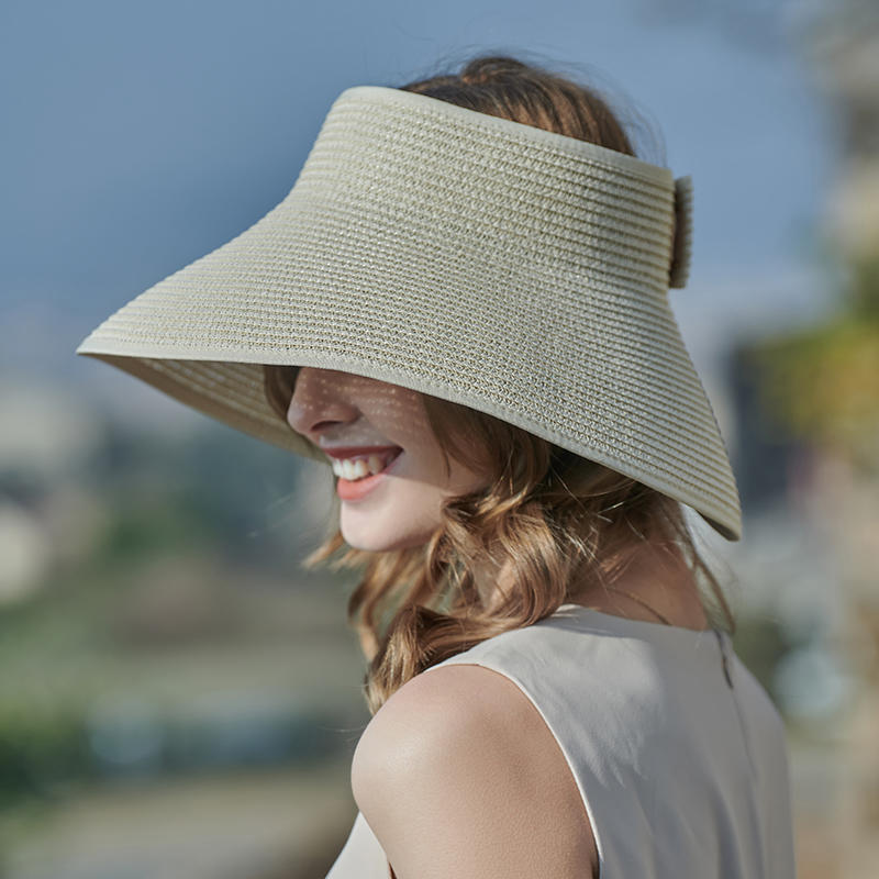 Sombrero de paja transparente superior primavera y verano nueva decoración de lazo sombrero de playa tejido versión coreana femenina del sombrero de copa vacío sombrilla al aire libre sombrero de protección solar